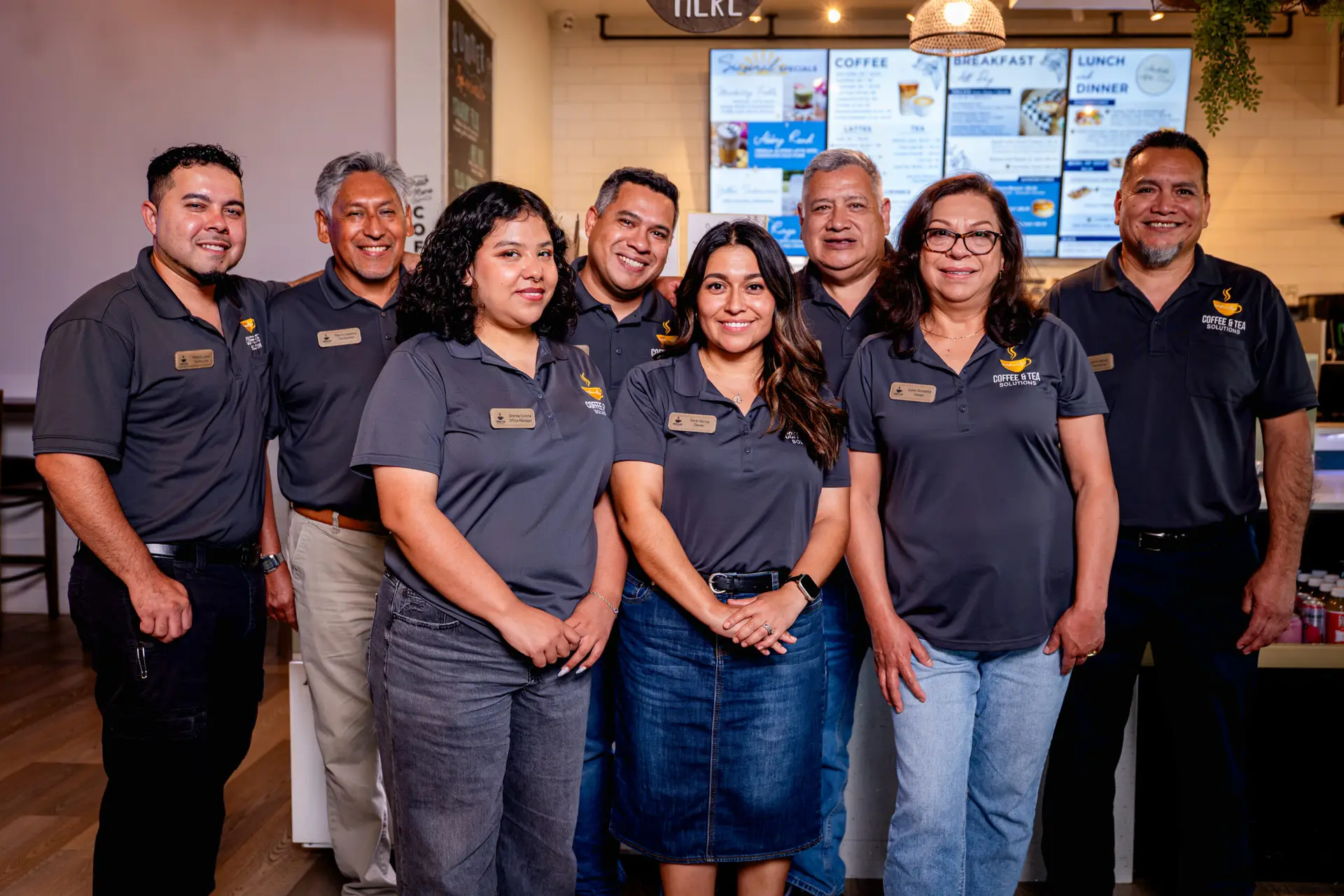 The Coffee & Tea Solutions family team in company uniforms, Burleson, TX