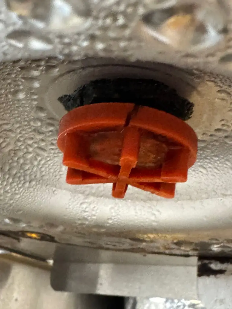 Mineral and residue buildup around a valve in beverage equipment
