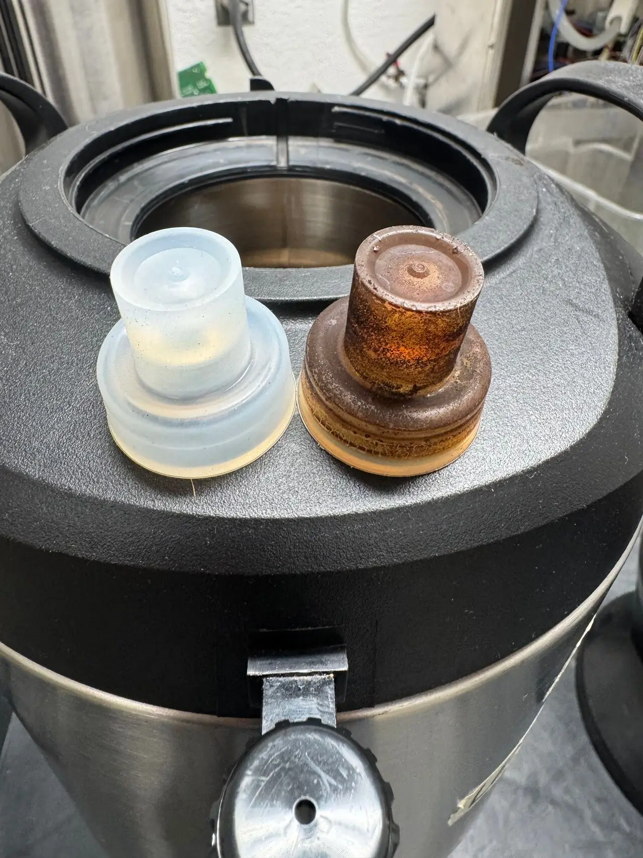 New faucet seal next to a stained, worn seal on a coffee server
